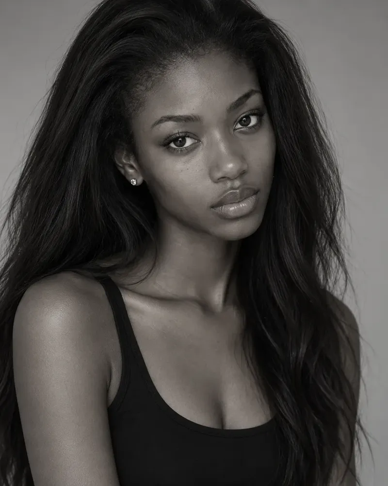 Three black and white photos of a model, laid out as they would be on a comp card