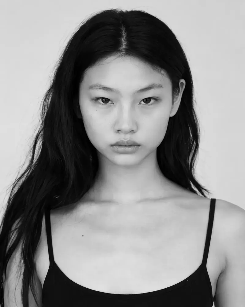 Three black and white photos of a model, laid out as they would be on a comp card