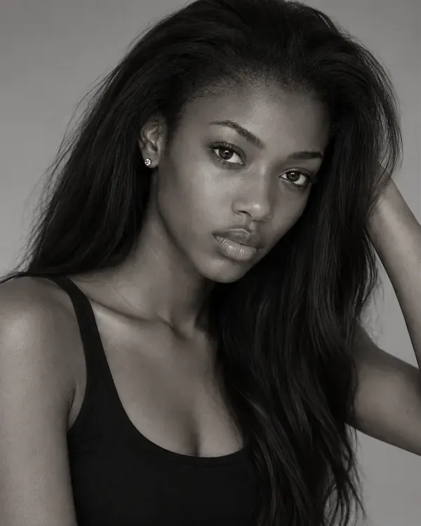 Three black and white photos of a model, laid out as they would be on a comp card